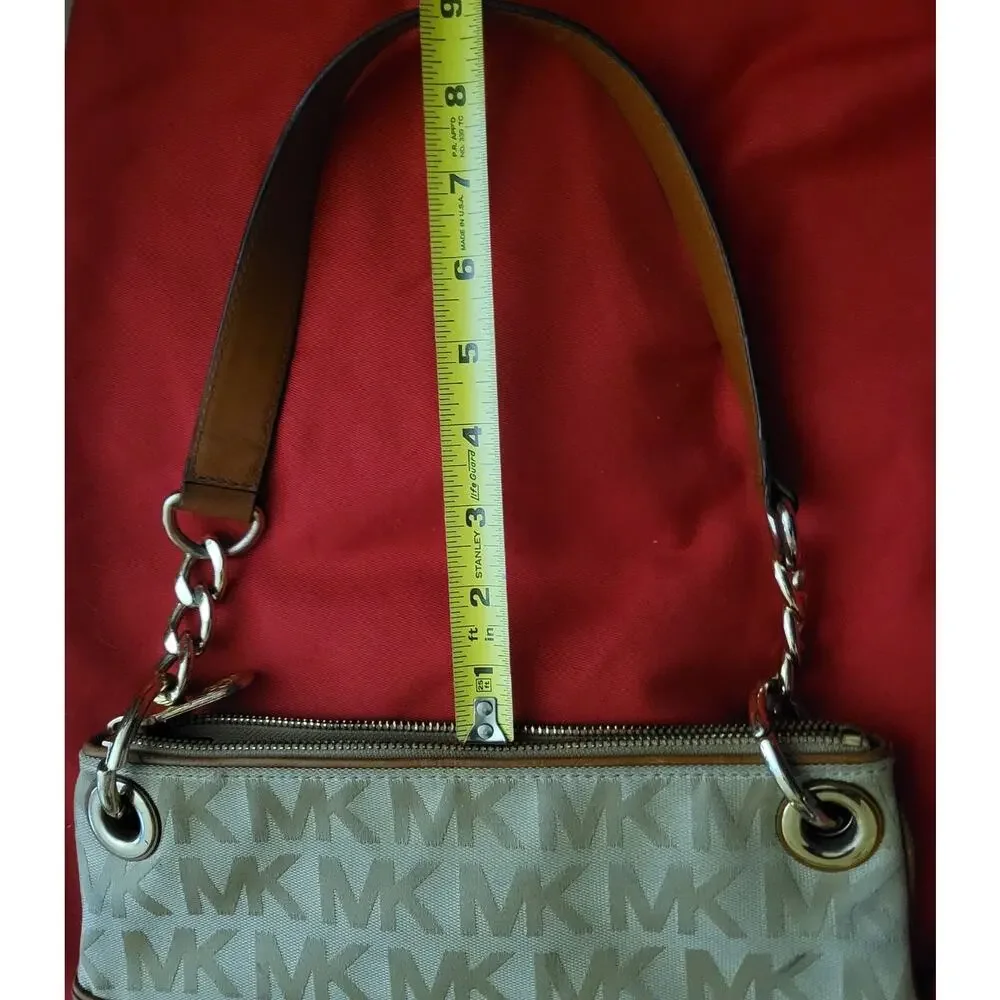Michael Kors Jamesport Signature Handbag Tab with Leather and Gold Trim Striking